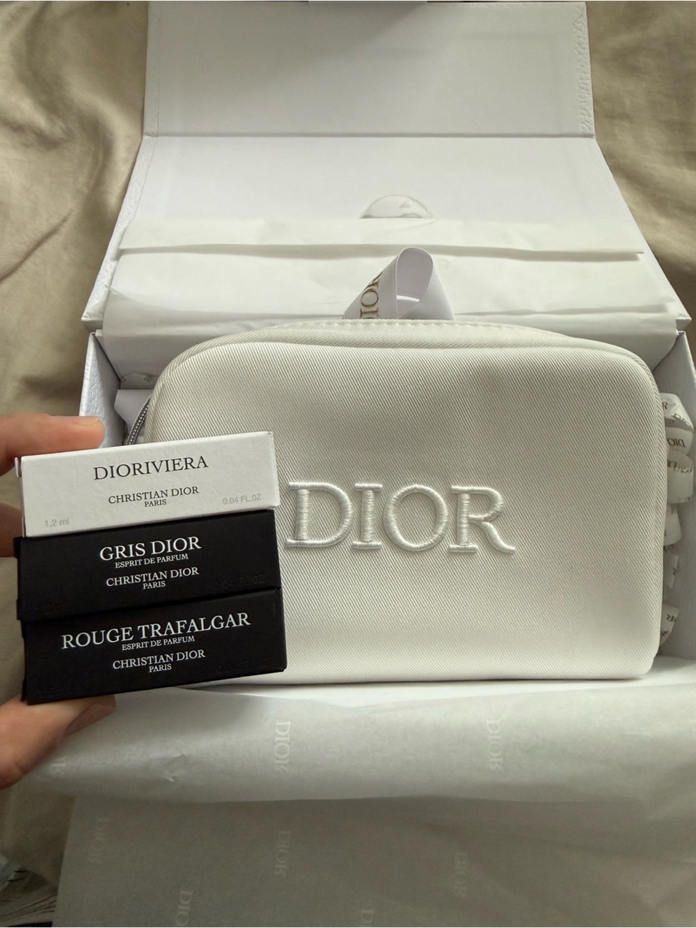 Dior White Embossed pouch with 3 samples in a gift box with a bow